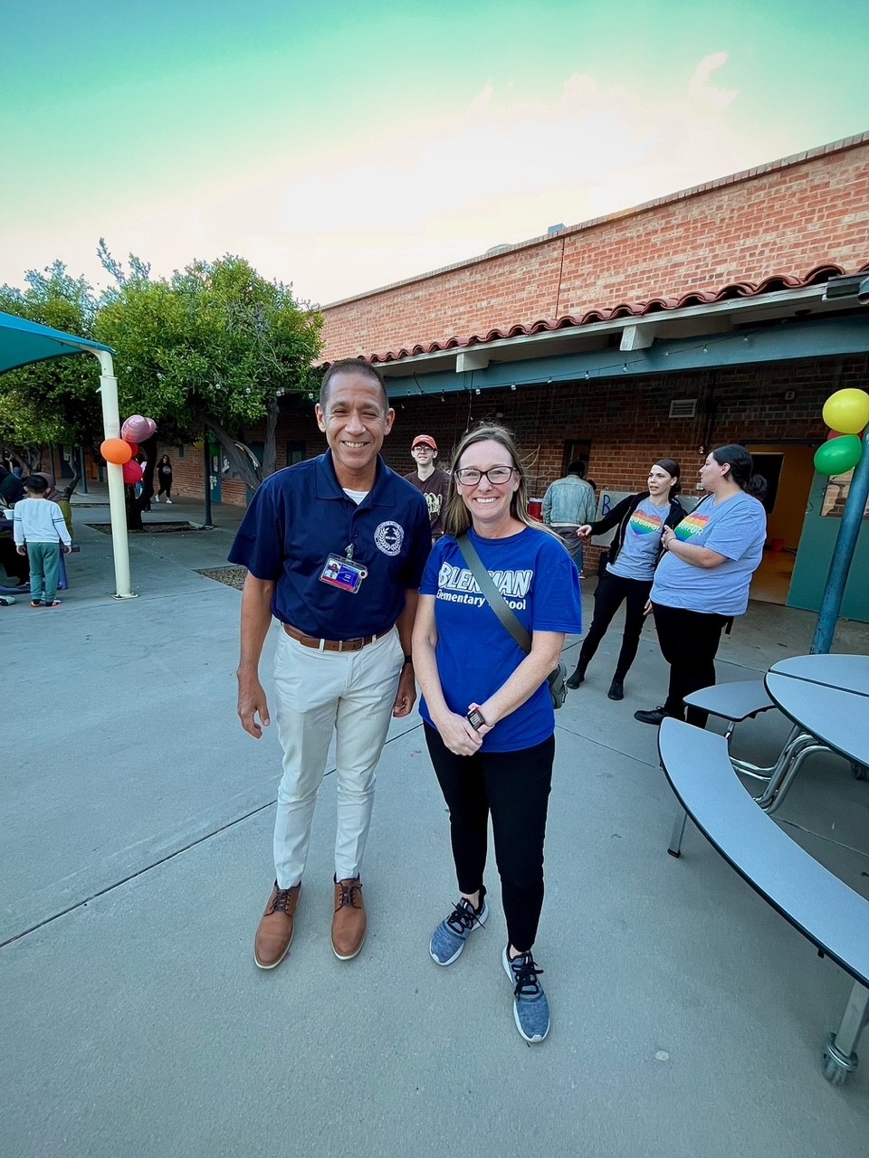 Dr. Trujillo poses next to Blenman's principal