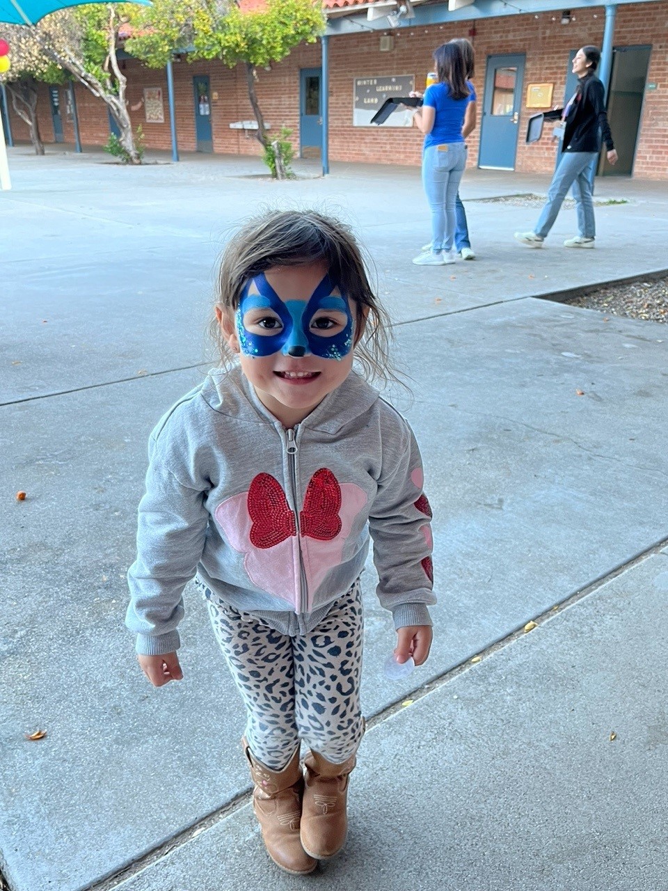 A little girl shows off her face paint!